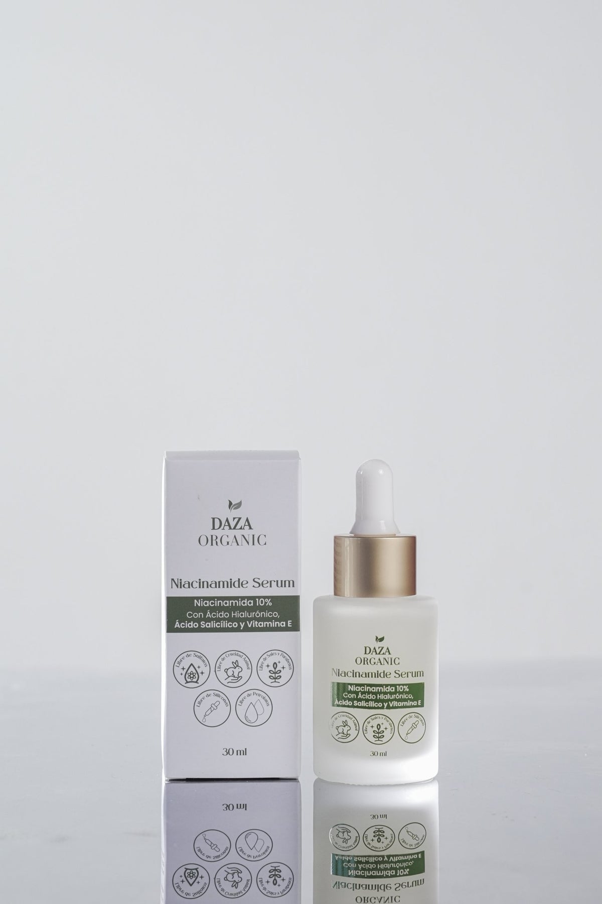 Frasco gotero del Niacinamide Serum de Daza Organic junto a su caja, sobre fondo gris claro.
